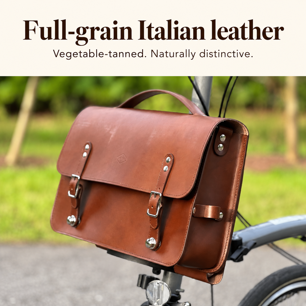 Brown Souma briefcase with full-grain Italian vegetable-tanned leather feature text
