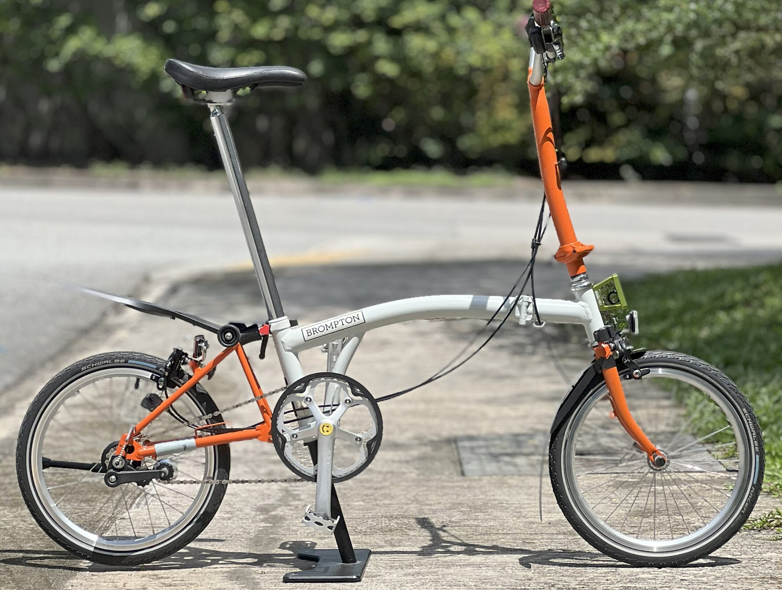 Brompton C Line H3E Papyrus White and Orange rental bike
