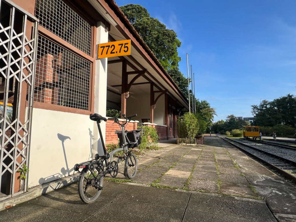 A Brompton folding bike parked in front of the old Bukit Timah Railway Station, built in 1932.