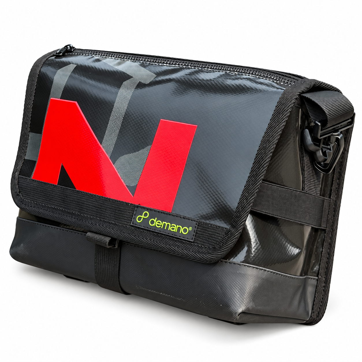 Demano Ribera 1704 charcoal and black Brompton mini front bag with a red front letter, grey banner details and black trim on white.
