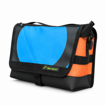 Demano Ribera 1705 Brompton mini front bag with a bright blue circular graphic on charcoal, an orange side panel and black trim on white.