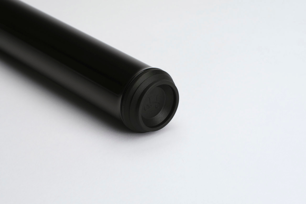 Close-up of the black end cap of the Brompton Cafe Lock extended seatpost.
