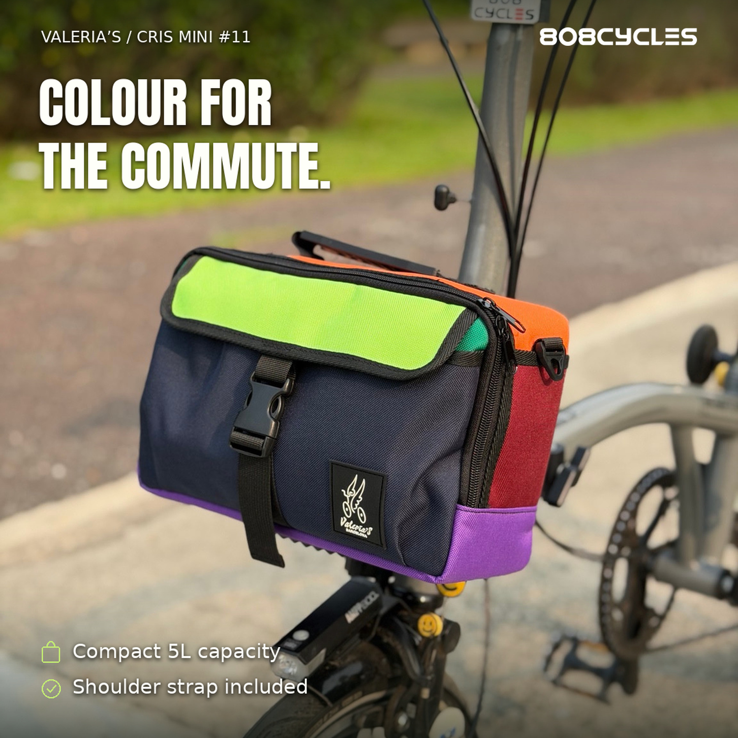 Feature graphic: Three-quarter front view of Cris Mini #11 colour-block bag on a Brompton