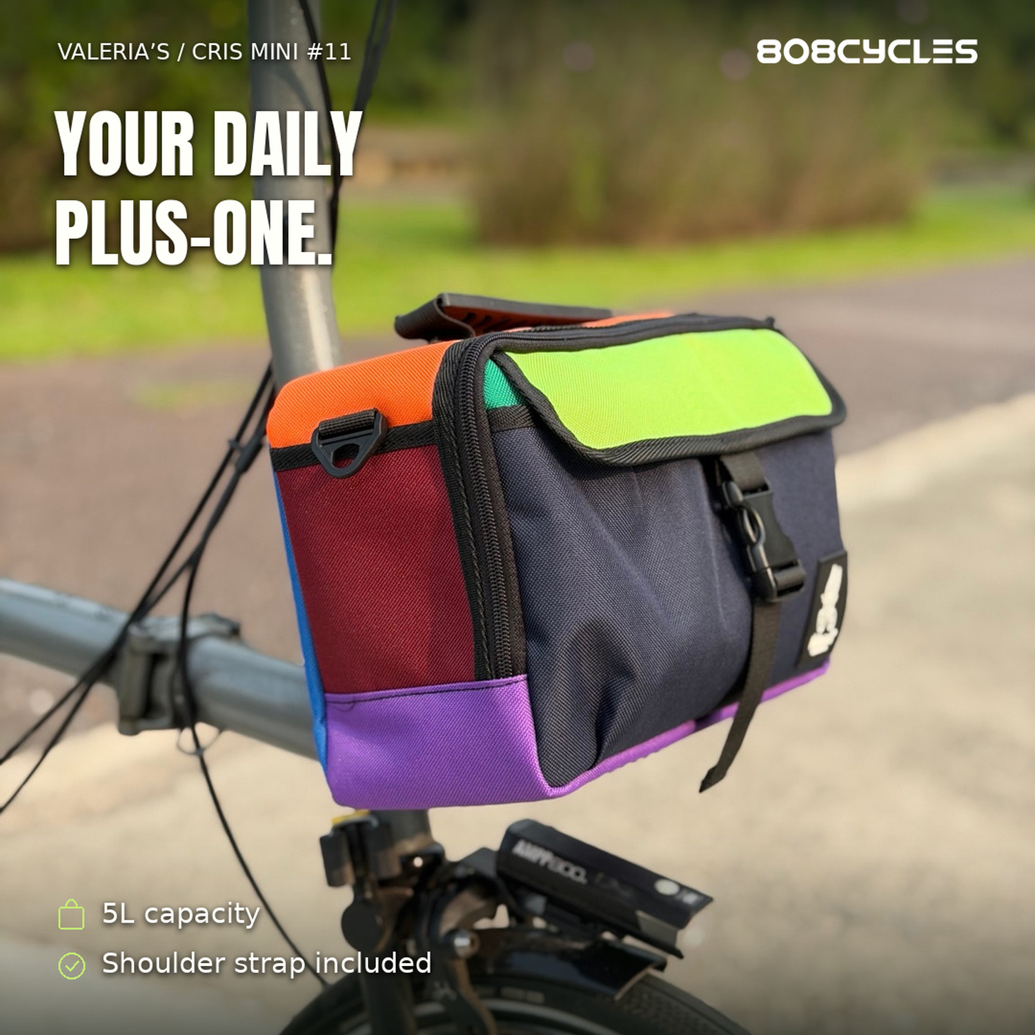 Feature graphic: Opposite three-quarter view of Cris Mini #11 colour-block Brompton bag